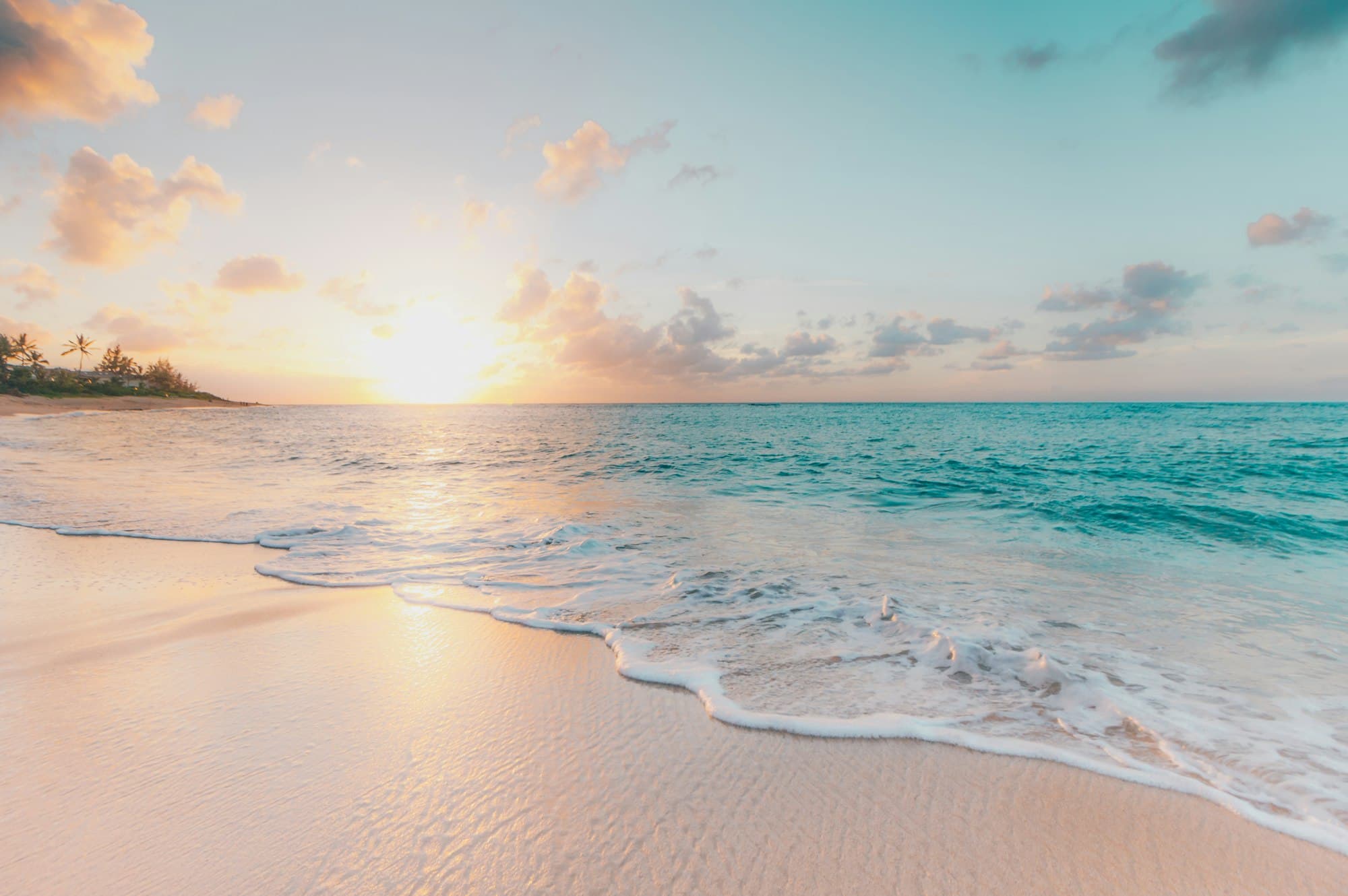 Early light over a pale Mediterranean shore.