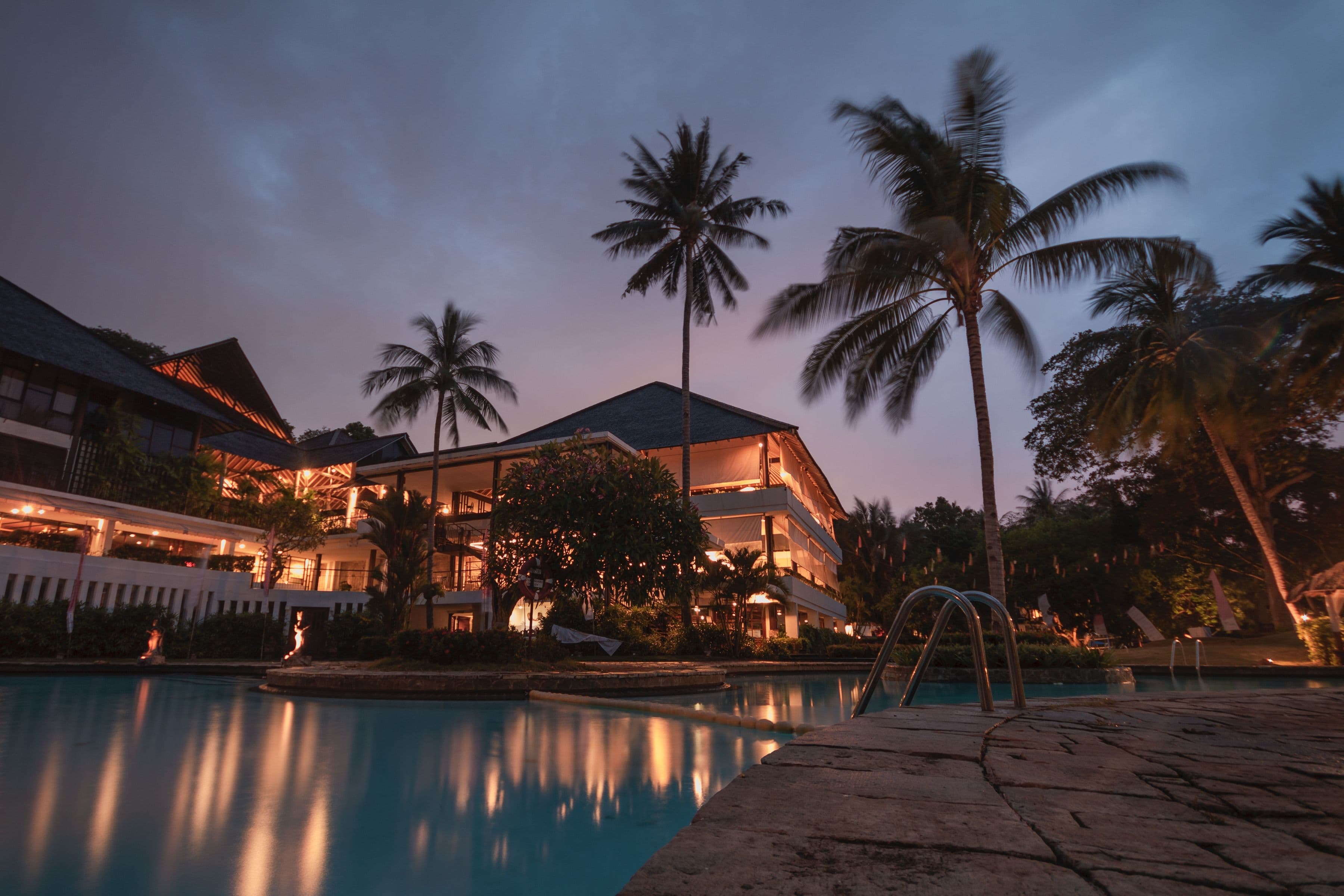 A low contemporary residence with a quiet pool terrace.